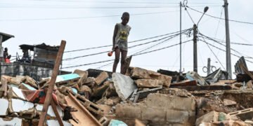 A child is seen among rubbles of the district of Attecoube in Abidjan, after the demolition of several houses on March 1, 2024. The governor of the distrit of Abidjan begun an operation to demolish high-risk neighborhoods in Abidjan. (Photo by Issouf SANOGO / AFP)